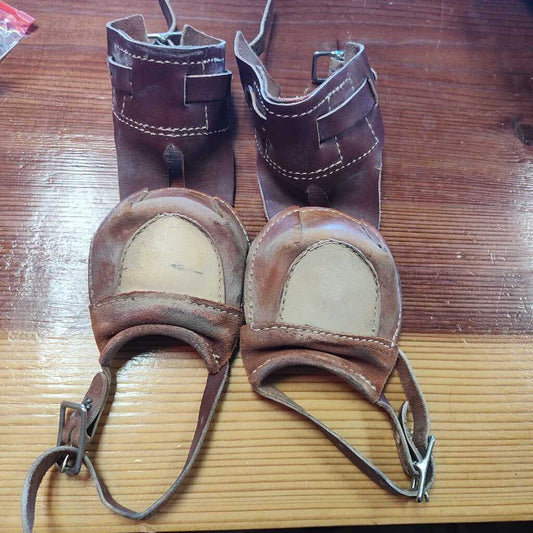 Leather skid boots with buckles