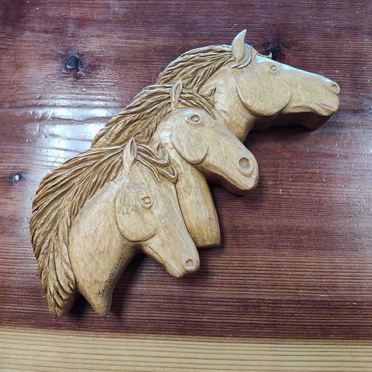 3 hand carved wood horse heads